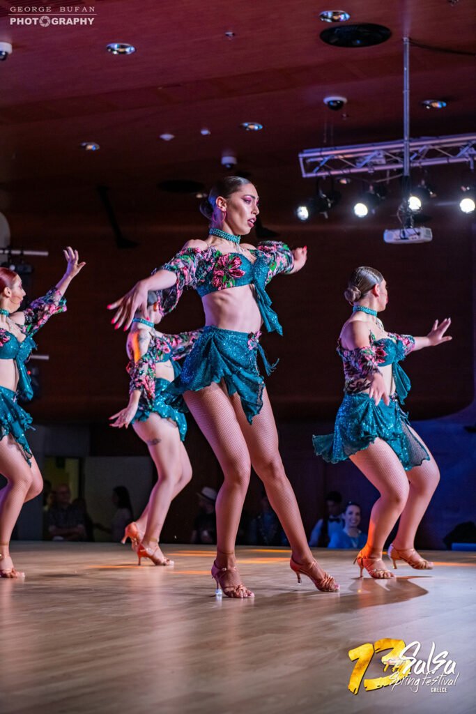 Kelly performing on stage with her salsa group